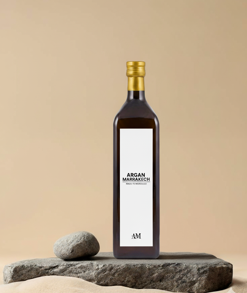 Bottle of Argan Marrakech oil on a beige background